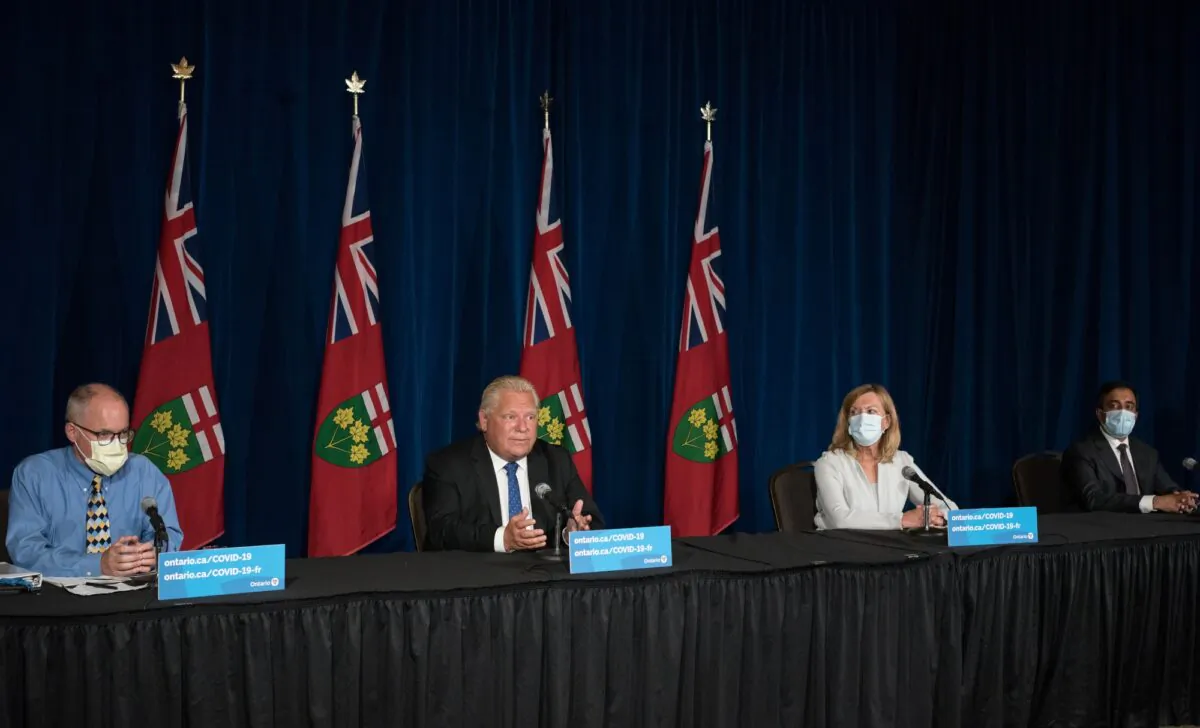 Ontario Premier Doug Ford (second L) responds to a question during a press conference at Queen's Park in Toronto on Sept. 1, 2021. Also present are Dr. Kieran Moore, Chief Medical Officer of Health; Christine Elliott, Deputy Premier and Minister of Health; and Kaleed Rasheed, Associate Minister of Digital Government. (The Canadian Press/ Tijana Martin)