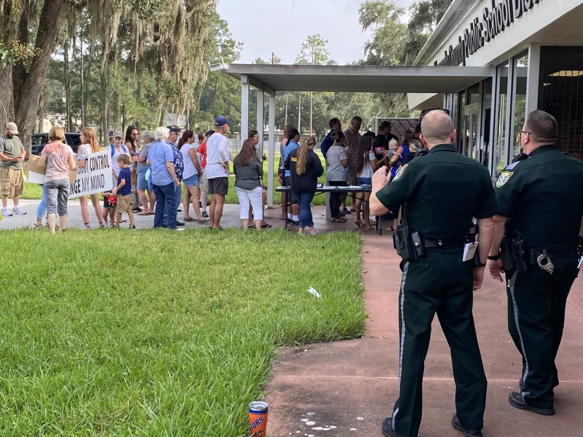 Citizens line up to attend the emergency school board meeting regarding a proposed mask mandate for children in Hernando, County, Fla, on Aug. 31, 2021. (Patricia Tolson/The Epoch Times)