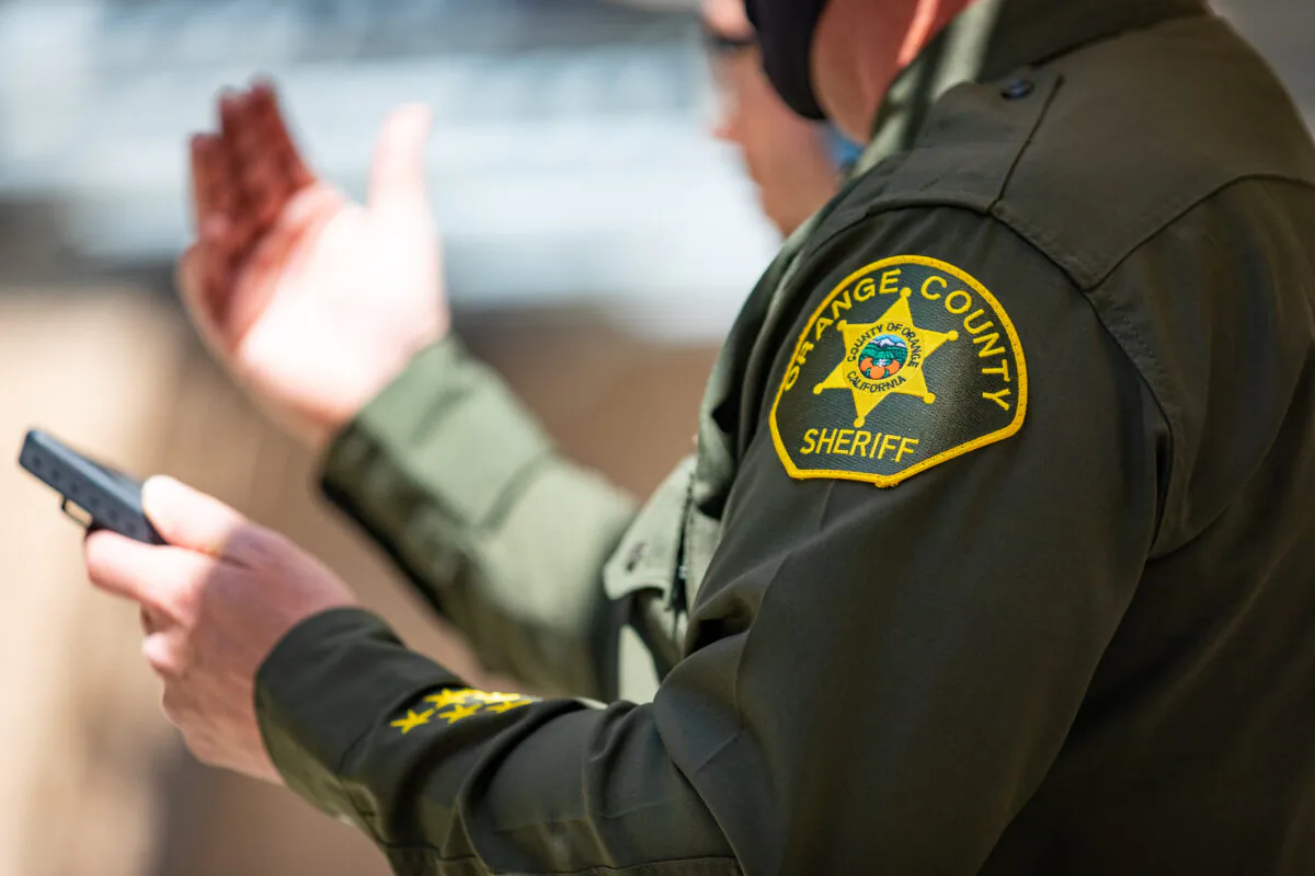 A sheriff's deputy speaks to reporters at the Orange County Sheriff's Department Law Enforcement Shooting Range in Orange, Calif., on March 30, 2021. (John Fredricks/The Epoch Times)