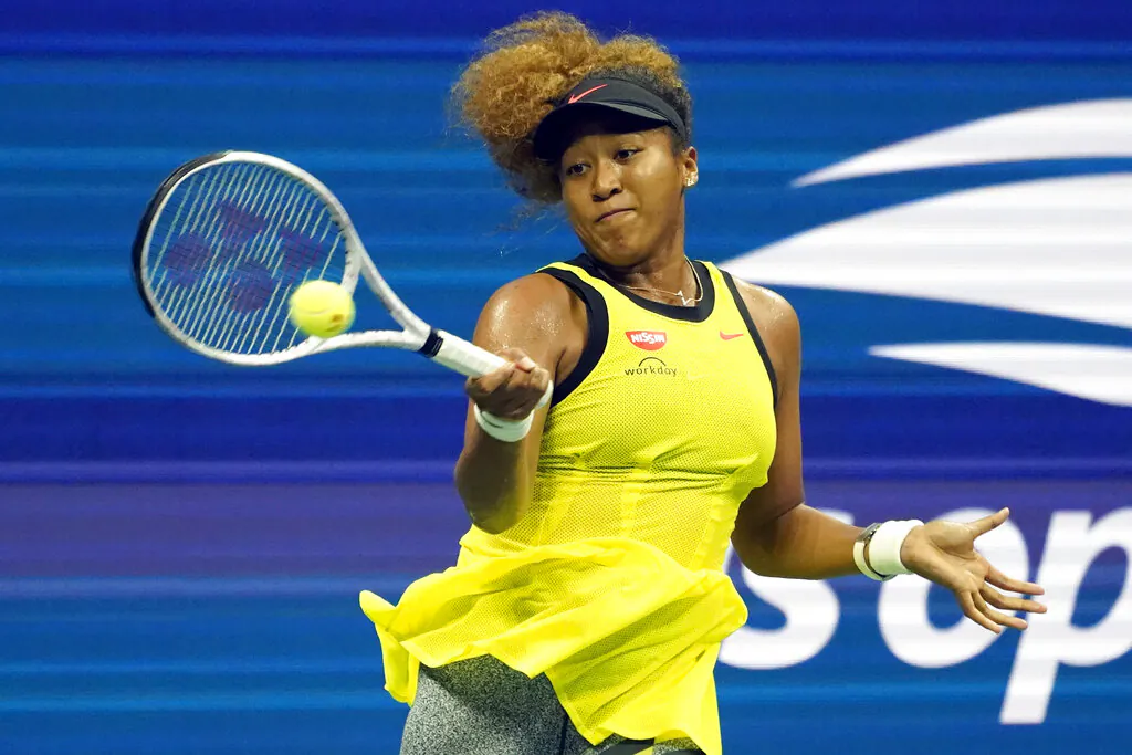 Naomi Osaka, of Japan, returns a shot to Marie Bouzkova, of the Czech Republic, during the first round of the US Open tennis championships in New York, on Monday, Aug. 30, 2021. (Elise Amendola/AP Photo)