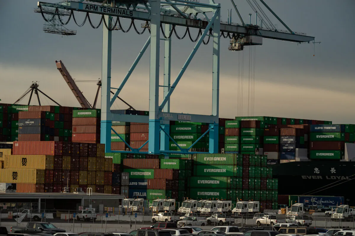 Shipping containers are loaded onto trucks at the Port of Los Angeles, in Long Beach, Calif., on Jan. 12, 2021. (John Fredricks/The Epoch Times)
