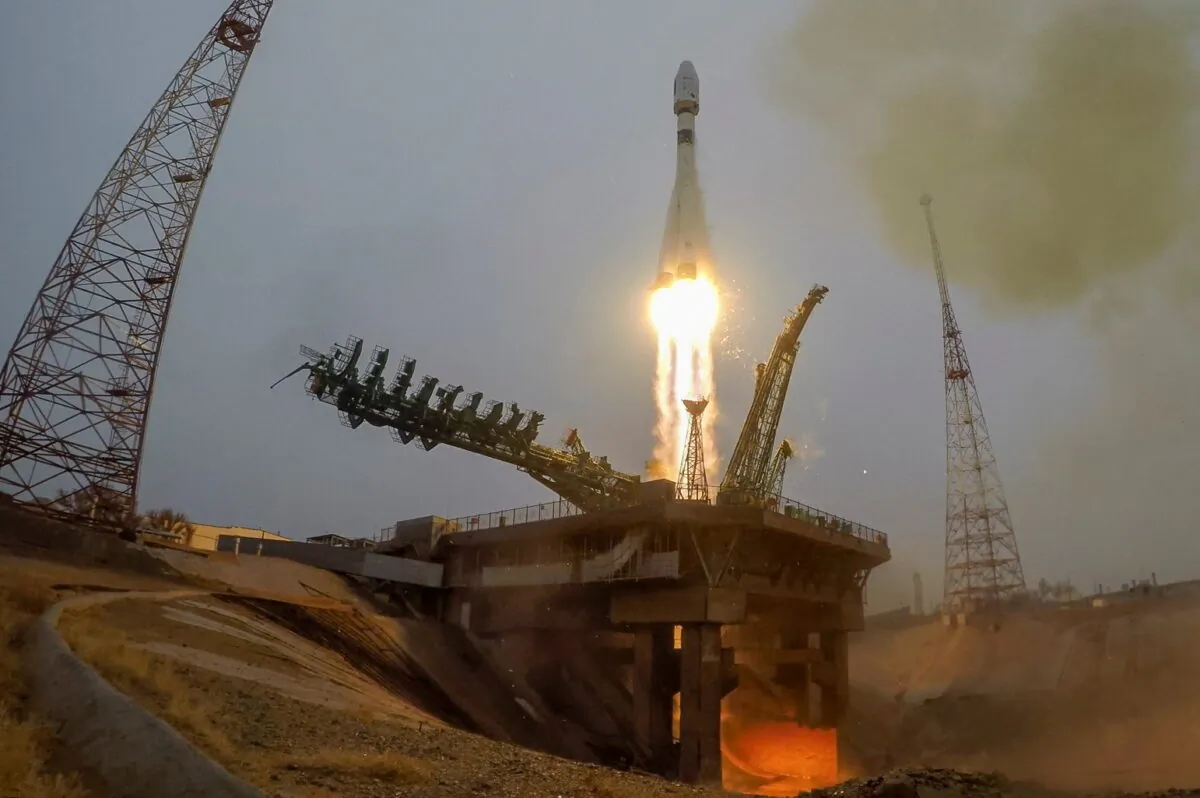 A Russian Soyuz-2.1a rocket with a Fregat upper stage and 38 satellites from 18 countries blasts off from a launchpad at the Baikonur Cosmodrome, Kazakhstan, Russia, on March 22, 2021. (Russian space agency Roscosmos/Handout via Reuters)