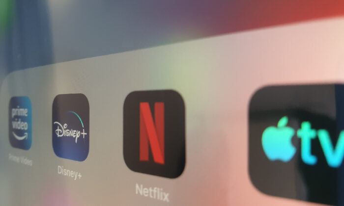 Netflix, Amazon Prime Video, Disney+, and Apple TV logos on an iPad in Dublin, Ireland, on Sept. 1, 2021. (Lily Zhou/The Epoch Times)