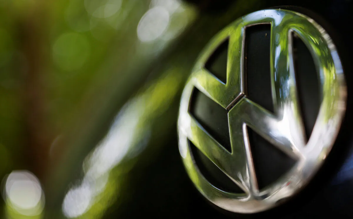 A logo of German carmaker Volkswagen is seen on a car parked on a street in Paris, France, on July 9, 2020. (Christian Hartmann/Reuters)