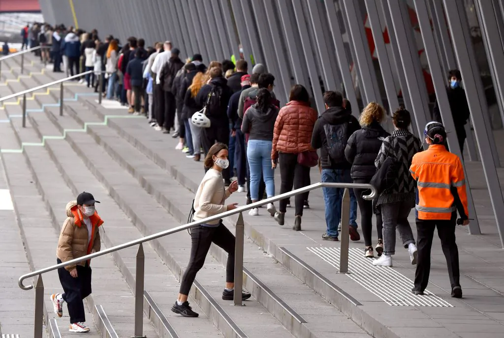 People form long queues outside a vaccination centre in Melbourne, Australia, on Aug. 27, 2021. (William West/AFP via Getty Images)