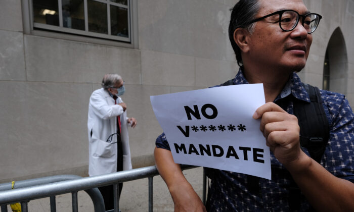 A small group of anti-vaccination mandate protesters gather outside of New York-Presbyterian Hospital in New York City on Sept. 1, 2021.   (Spencer Platt/Getty Images)