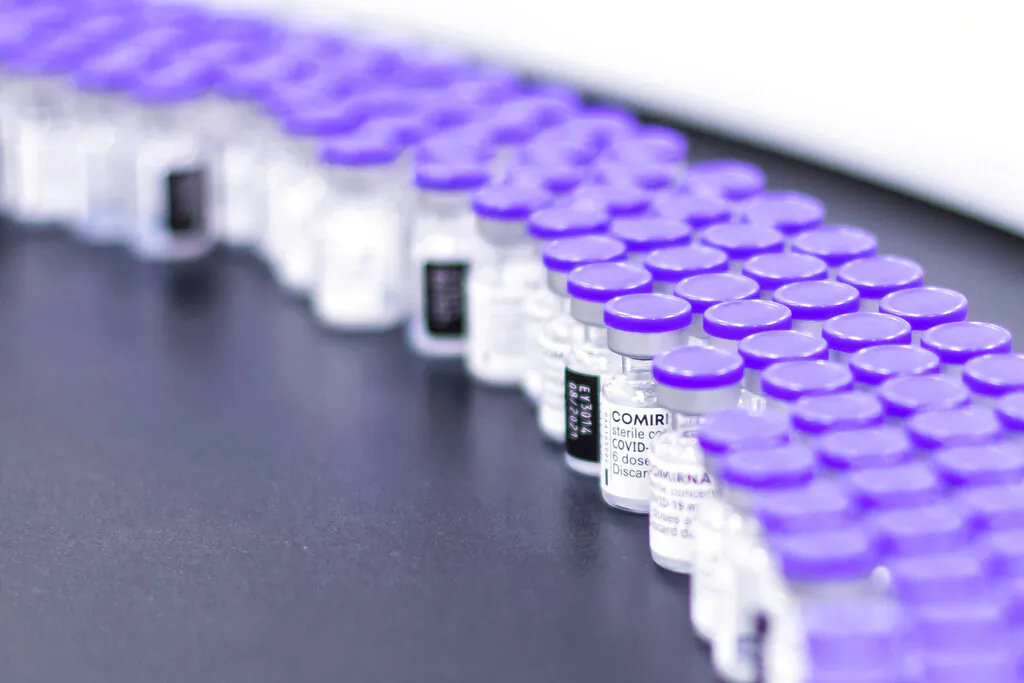 Vials of the Pfizer-BioNTech COVID-19 vaccine are prepared for packaging at Pfizer's facility in Puurs, Belgium, March 2021. (Pfizer via AP)