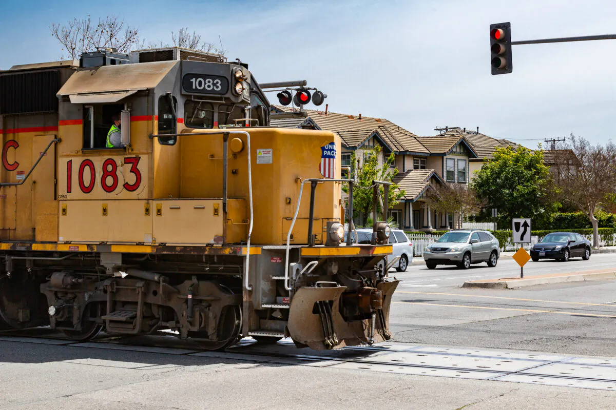 A train moves past Harbor Boulevard in Anaheim, Calif., on April 6, 2021. (John Fredricks/The Epoch Times)