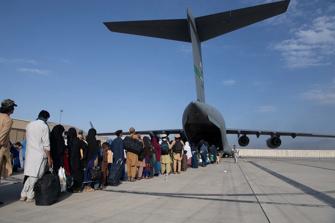 In this handout provided by U.S. Central Command Public Affairs, passengers board a U.S. Air Force C-17 as part of the evacuation from Afghanistan, at Hamid Karzai International Airport in Kabul, Afghanistan, on Aug. 24, 2021. (Master Sgt. Donald R. Allen/U.S. Air Forces Europe-Africa via Getty Images)