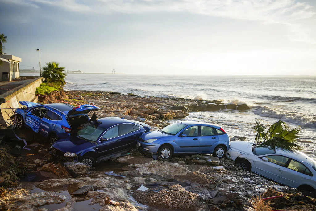 Wrecked cars stuck in the shore of the seaside town of Alcanar, in northeastern Spain, on Thursday, Sept. 2, 2021. (Joan Mateu Parra/AP Photo)