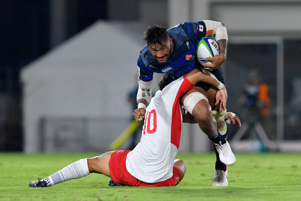 Amanaki Lelei Mafi of Japan being tackled by Latiume Fosita of Tonga during the Pacific Nations Cup match between Japan and Tonga at Hanazono Rugby Staidum in Higashiosaka, Osaka, Japan, on Aug. 3, 2019. (Koki Nagahama/Getty Images)