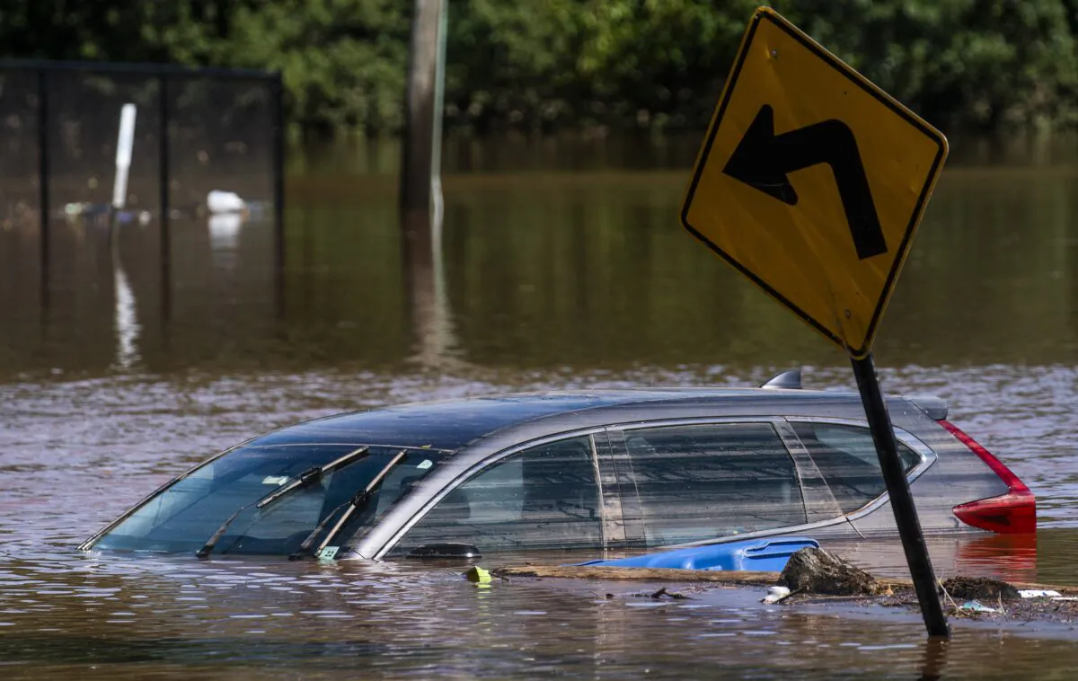 A car flooded on a local street as a result of the remnants of Hurricane Ida is seen in Somerville, N.J., on Sept. 2, 2021. (Eduardo Munoz Alvarez/AP Photo)
