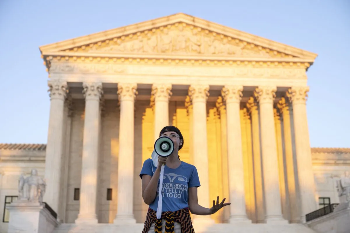 An activist speaks outside the Supreme Court in protest against the new Texas abortion law in Washington on Sept. 2, 2021. (Drew Angerer/Getty Images)