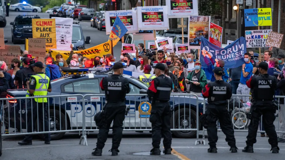 Protesters gather outside the TVA French language debate in Montreal on September 2, 2021. Canadians will vote in a federal election Sept. 20th. (The Canadian Press/Frank Gunn)