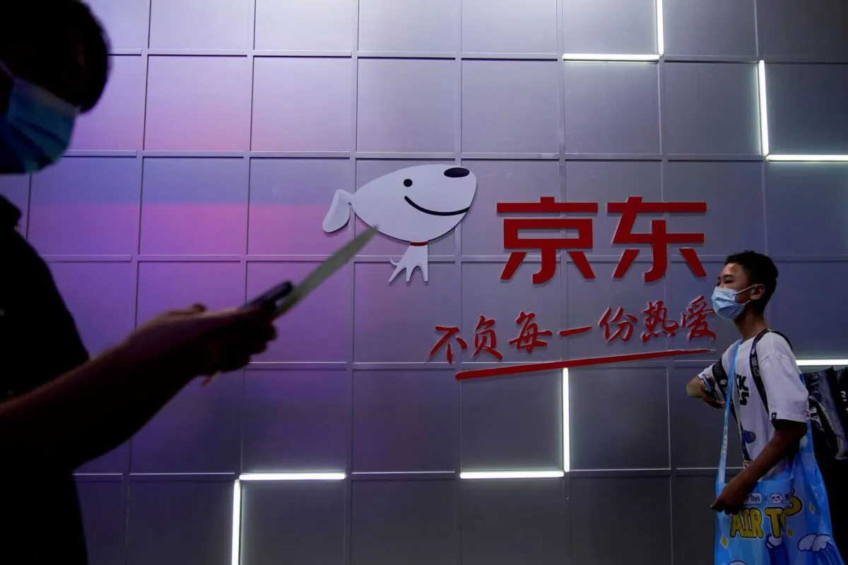 A sign of JD.com is seen at the China Digital Entertainment Expo and Conference, also known as ChinaJoy, in Shanghai, China on July 30, 2021. (Aly Song/Reuters)