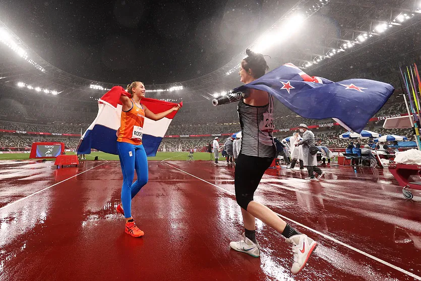 Silver medalist Noelle Roorda (L) of Team Netherlands celebrates with gold medalist Holly Robinson of Team New Zealand following the Women's Javelin Throw at the Tokyo 2020 Paralympic Games at the Olympic Stadium in Tokyo, Japan, on Sept. 3, 2021. (Dean Mouhtaropoulos/Getty Images)