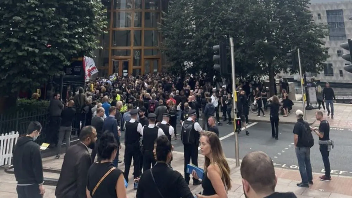 A group of protesters outside of the MHRA headquarters in central London, where police blocked them from entering, on Sept. 3, 2021 (Andrew Wood/Twitter/PA)