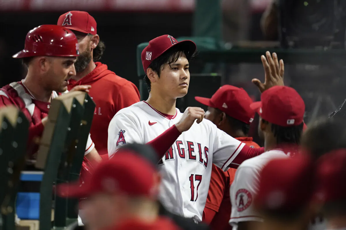 Los Angeles Angels starting pitcher Shohei Ohtani (17) returns to the dugout after pitching during the seventh inning of a baseball game against the Texas Rangers in Anaheim, Calif., on Sept. 3, 2021. (AP Photo/Ashley Landis)