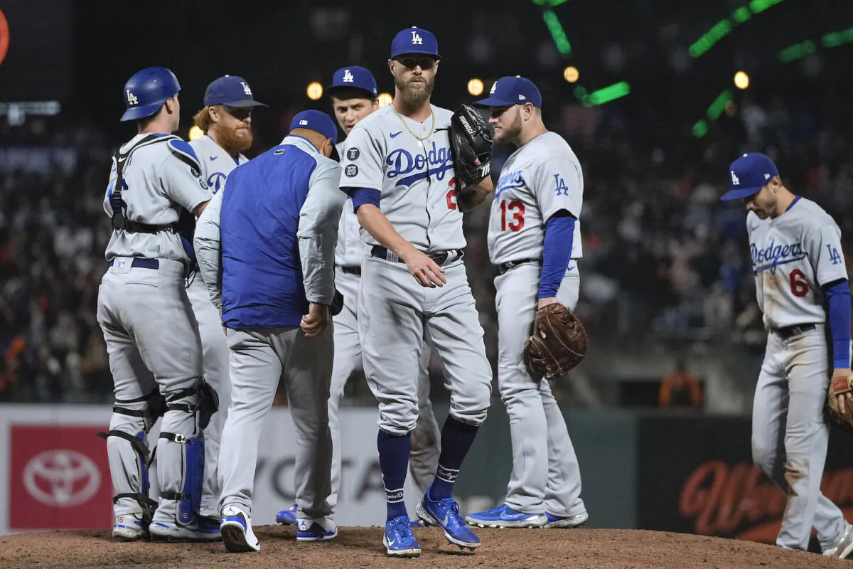 Los Angeles Dodgers relief pitcher Shane Greene (28) is taken out by manager Dave Roberts during the fifth inning against the San Francisco Giants in a baseball game in San Francisco on Sept. 3, 2021. (AP Photo/Tony Avelar)