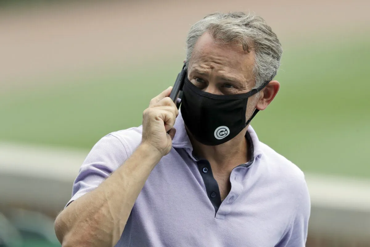 Chicago Cubs general manager Jed Hoyer talks on a mobile phone during the team's baseball practice at Wrigley Field in Chicago, on July 8, 2020. (Nam Y. Huh/AP Photo, File)