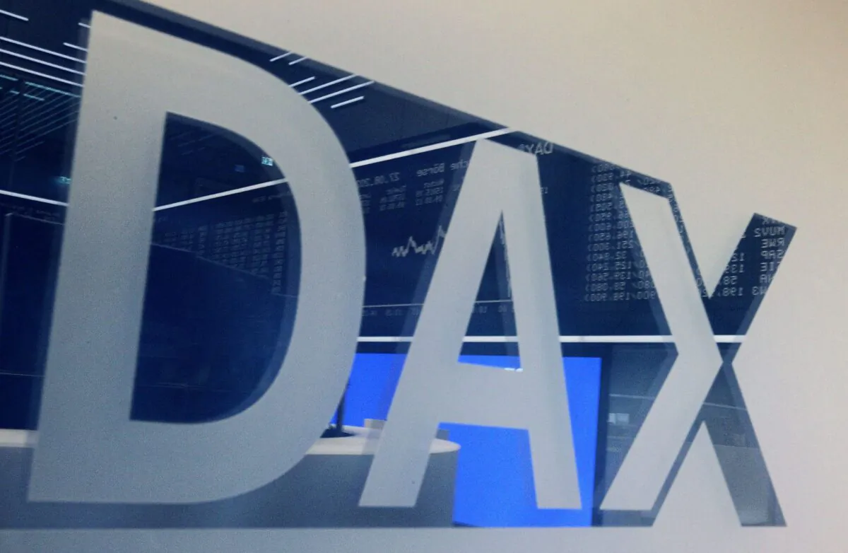 A board displaying the chart of Germany's share index DAX reflects in a window with the DAX logo at the stock exchange in Frankfurt am Main, western Germany on Aug. 27, 2021. (Daniel Roland/AFP via Getty Images)