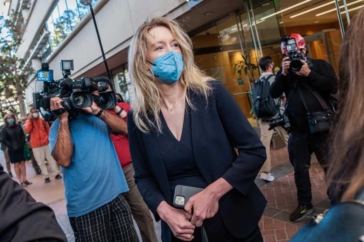 Elizabeth Holmes, the founder and former CEO of blood testing and life sciences company Theranos, arrives for the first day of jury selection in her fraud trial, outside Federal Court in San Jose, Calif., on Aug. 31, 2021. (Nick Otto/AFP via Getty Images)