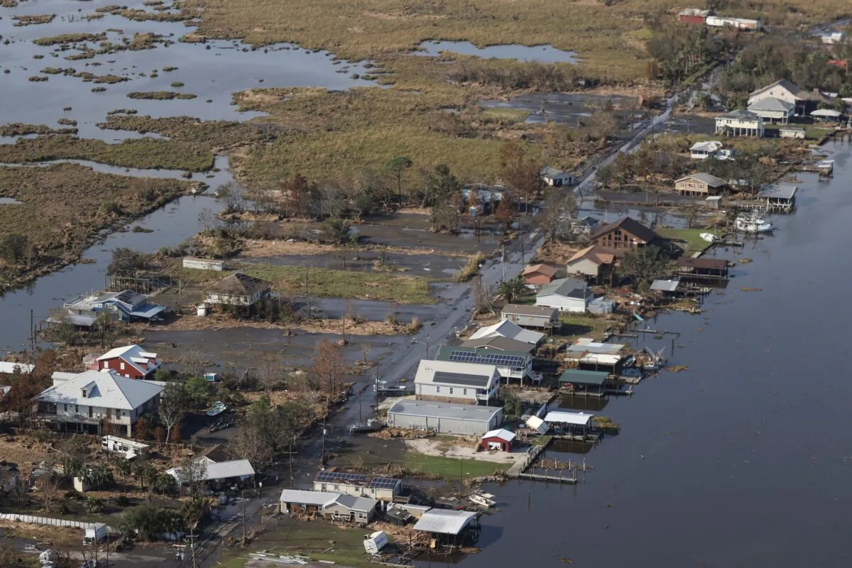 A view of flood damaged buildings is seen as President Joe Biden (not pictured) inspects the damage from Hurricane Ida on the Marine One helicopter during an aerial tour of communities in Laffite, Grand Isle, Port Fourchon, and Lafourche Parish, La., on Sept. 3, 2021. (Jonathan Ernst/Pool via AP)