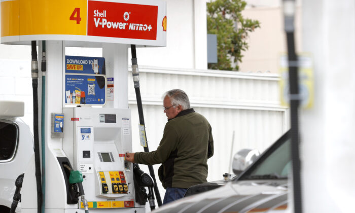 A customer prepares to pump gas at a Shell station in San Francisco on July 12, 2021. (Justin Sullivan/Getty Images)