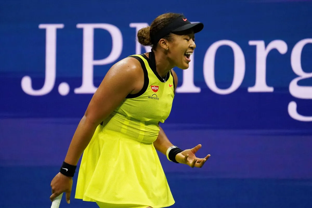 Naomi Osaka, of Japan, reacts during a match against Leylah Fernandez, of Canada, at the third round of the U.S. Open tennis championships, N.Y., on Sept. 3, 2021. (John Minchillo/AP Photo)