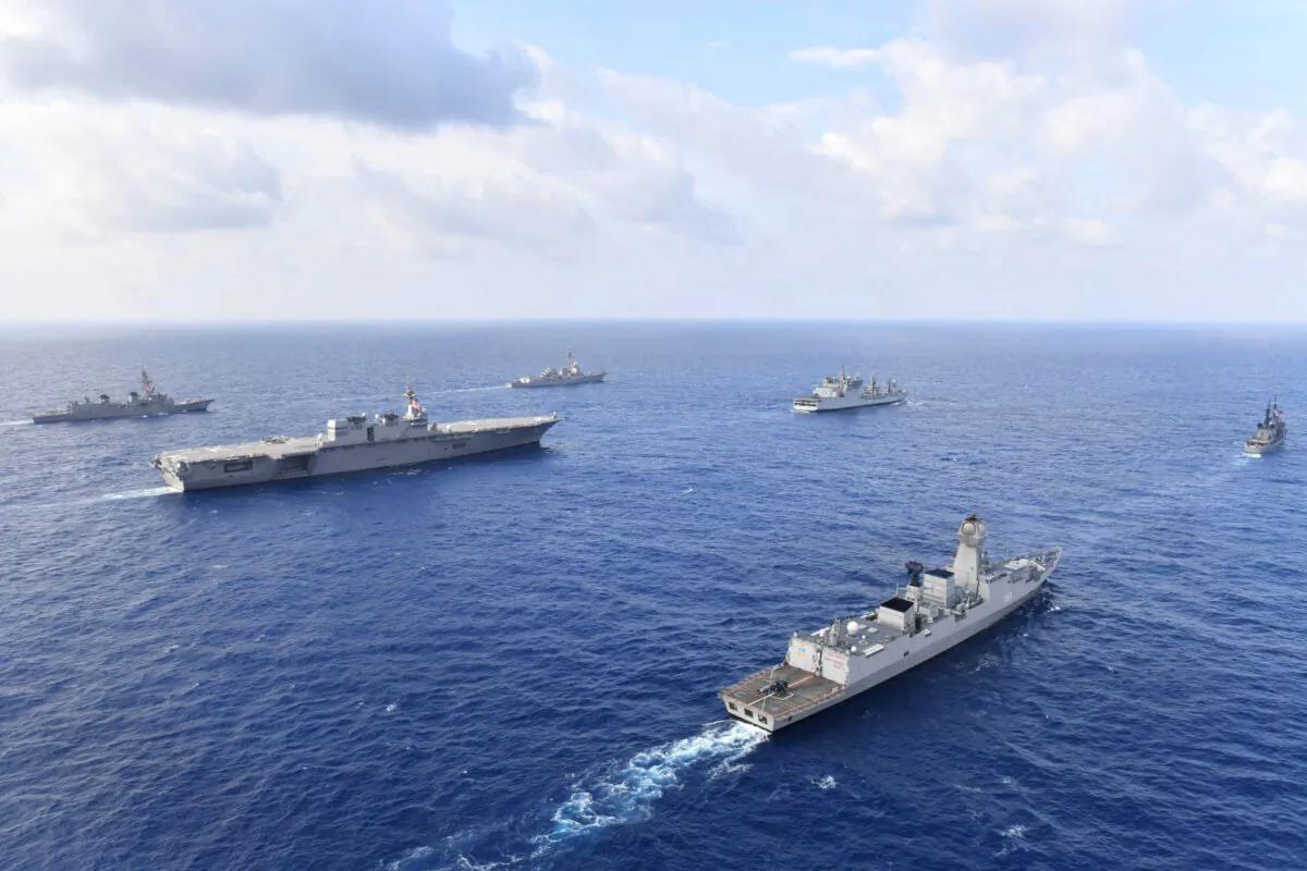 Naval vessels from the United States, Japan, India, and the Philippines conduct formation exercises and communication drills in the South China Sea in May 2019. (Japan Maritime Self-Defense Force/U.S. Navy)