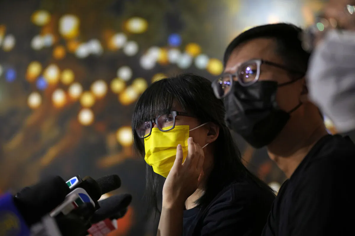 Chow Han Tung (L), vice chairwoman of the Hong Kong Alliance in Support of Patriotic Democratic Movements of China, and other group members attend a news conference in Hong Kong, on Sept. 5, 2021. (Kin Cheung/AP Photo)