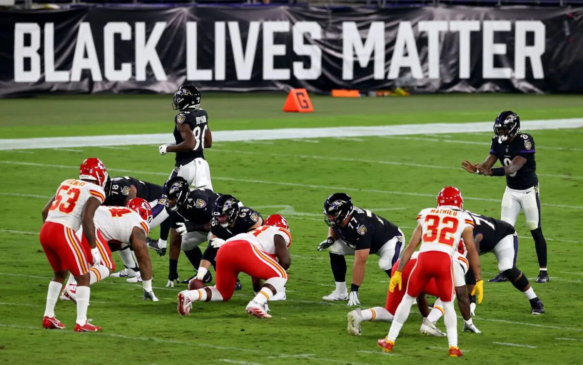 Lamar Jackson #8 of the Baltimore Ravens waits for the snap in front a sign that reads "Black Lives Matter" against the Kansas City Chiefs at M&T Stadium on Sept. 28, 2020 in Baltimore, Maryland. (Todd Olszewski/Getty Images)