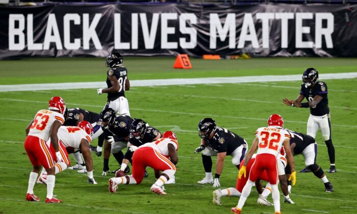Lamar Jackson #8 of the Baltimore Ravens waits for the snap in front a sign that reads "Black Lives Matter" against the Kansas City Chiefs at M&T Stadium on Sept. 28, 2020 in Baltimore, Maryland. (Todd Olszewski/Getty Images)