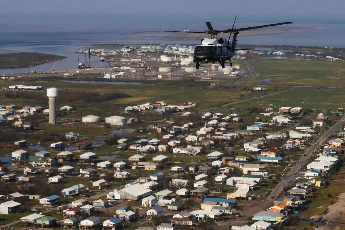 President Joe Biden, onboard Marine One, inspects the damage from Hurricane Ida on an aerial tour of communities in Laffite, Grand Isle, Port Fourchon and Lafourche Parish, Louisiana, on Sept. 3, 2021. (Jonathan Ernst/POOL/AFP via Getty Images)