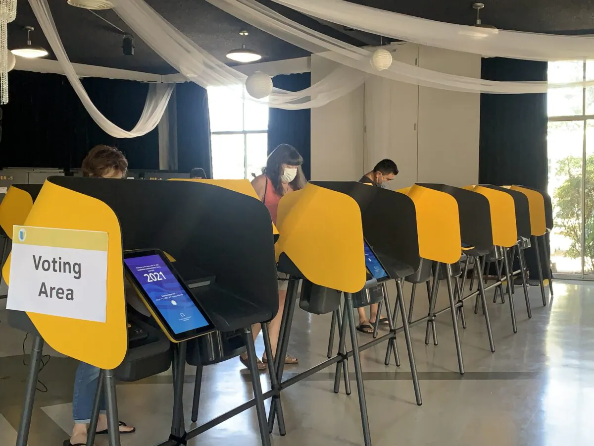 Voters cast their votes in person at a poll station in Arcadia, California, on Sept. 4, 2021. (Linda Jiang/The Epoch Times)