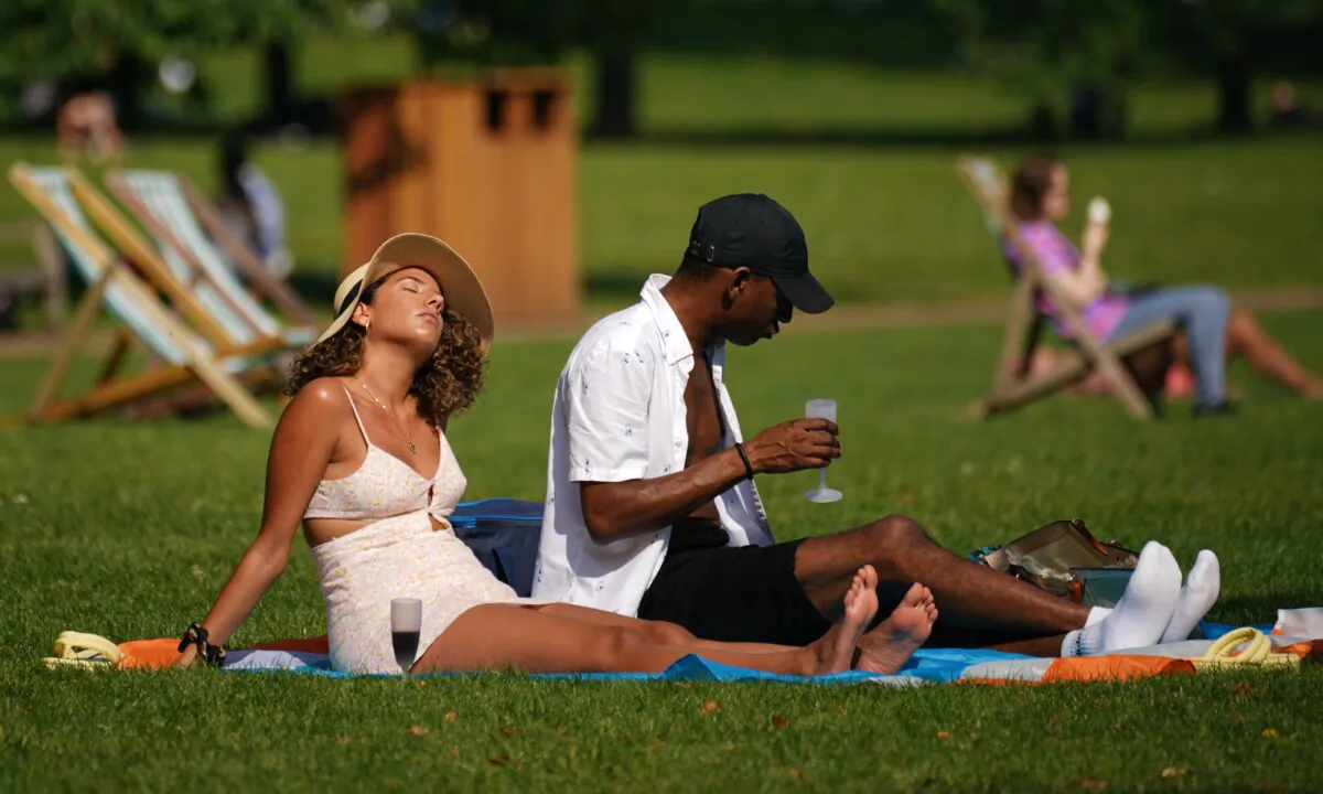 People enjoy the sun in St. James's Park, London, on Sept. 5, 2021. (Yui Mok/PA)