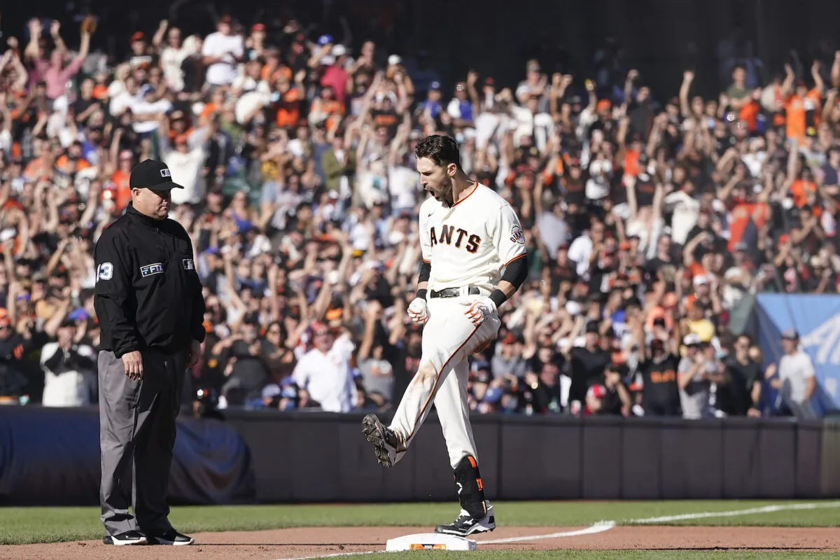 San Francisco Giants’ Steven Duggar celebrates after hitting a two-run triple against the Los Angeles Dodgers during the second inning of a baseball game in San Francisco on Sept. 5, 2021. (AP Photo/Jeff Chiu)