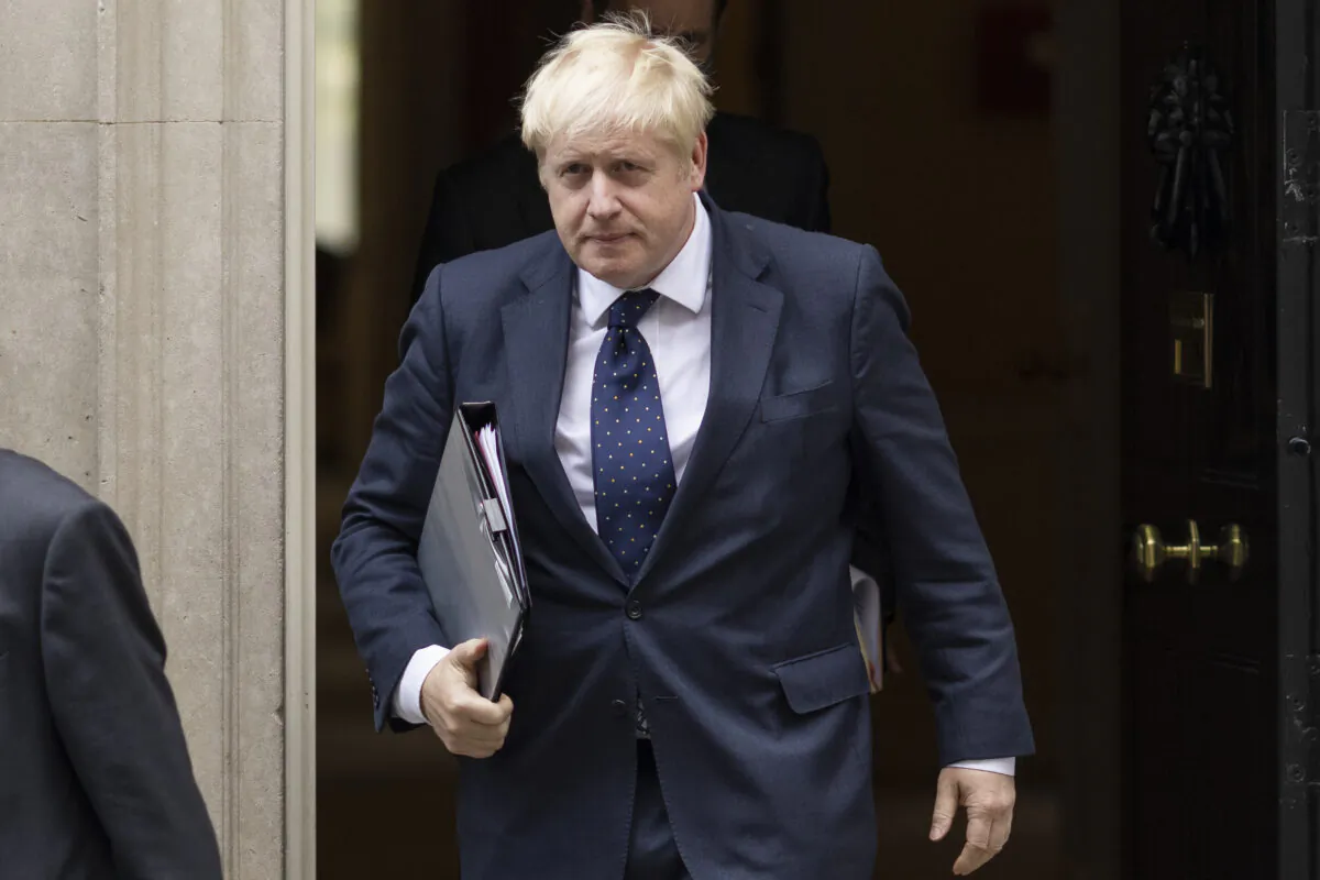British Prime Minister Boris Johnson leaves 10 Downing Street to deliver a statement on Afghanistan in the House of Commons in London, on Sept. 6, 2021. (Dan Kitwood/Getty Images)