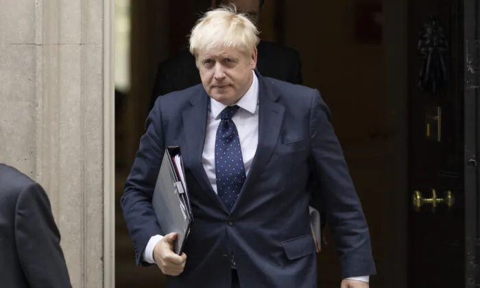 British Prime Minister Boris Johnson leaves 10 Downing Street to deliver a statement on Afghanistan in the House of Commons in London on Sept. 6, 2021. (Dan Kitwood/Getty Images)