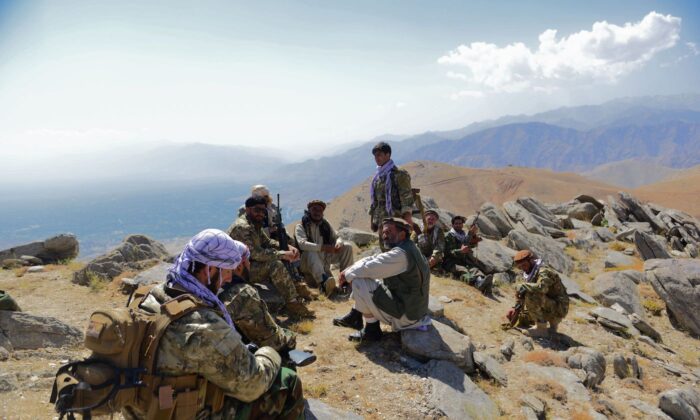 Afghan resistance movement and anti-Taliban forces take rest as they patrol on a hilltop in Darband area in Anaba district, Panjshir province on Sept. 1, 2021. Panjshir remains the last major holdout of anti-Taliban forces led by Ahmad Massoud, son of the famed Mujahideen leader Ahmed Shah Massoud. (Ahmad Sahel Arman/AFP via Getty Images)