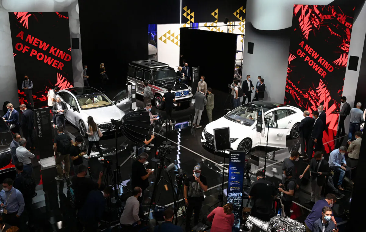 Fair goers inspect Mercedes cars during a press preview at the International Motor Show (IAA), on September 6, 2021 in Munich, southern Germany. - Germany's revamped IAA auto show, one of the world's largest, officially opens in Munich on September 7, for a celebration of all things car-related, but climate concerns and pandemic woes threaten to spoil the party. (Photo by Christof Stache / AFP) (Photo by CHRISTOF STACHE/AFP via Getty Images)