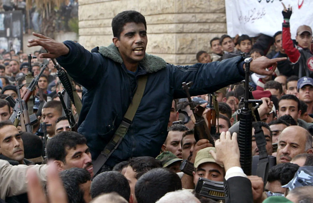 Palestinian commander of the Israeli-designated terrorist group Al Aqsa Martyrs Brigades Zakaria Zubeidi is carried on the shoulders of supporters in Jenin, in the West Bank, on Dec. 30, 2004. (Ammar Awad/Reuters)