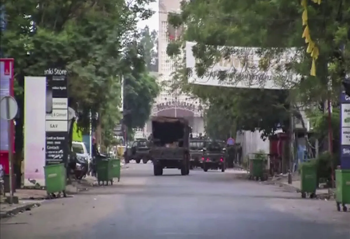 In this image made from video, a military truck is seen near the presidential palace in the capital Conakry, Guinea on Sept. 5, 2021. (AP Photo)