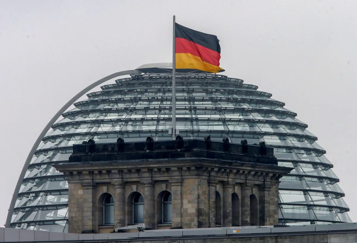 A German flag flutters over the Reichstag building in Berlin, Germany on Sept. 24, 2017. (Michael Probst/AP Photo)
