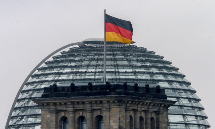 A German flag flutters over the Reichstag building in Berlin, Germany on Sept. 24, 2017. (Michael Probst/AP Photo)