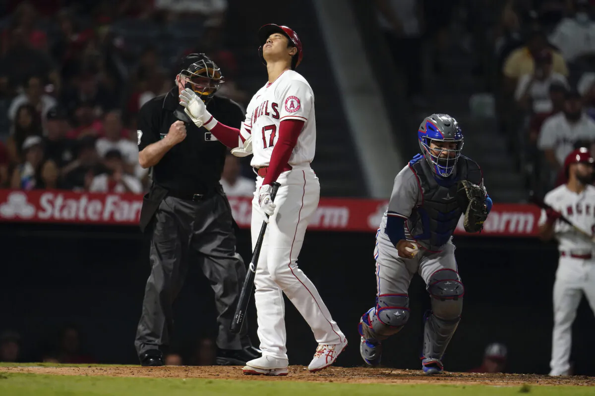 Los Angeles Angels' Shohei Ohtani reacts after being called out on strikes during the sixth inning of a baseball game against the Texas Rangers in Anaheim, Calif., on Sept. 6, 2021. (AP Photo/Marcio Jose Sanchez)