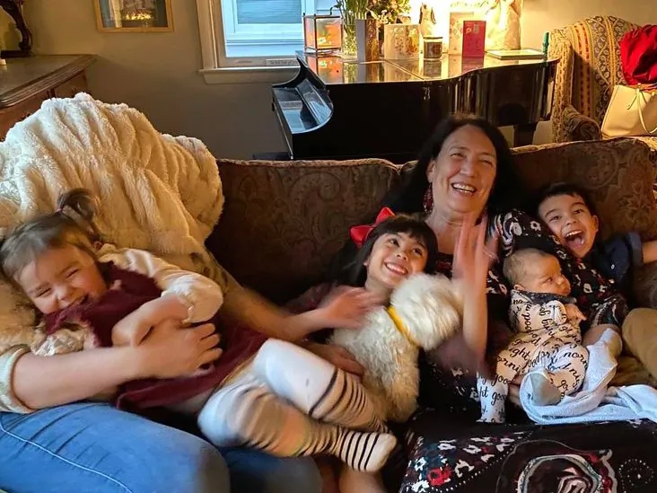 Anita Sherman delights in her grandbabies. Here they share the couch and much laughter. Pictured (L-R) Ada, Maria, Anita, Harrison and Piers. (Courtesy of Anita Sherman)