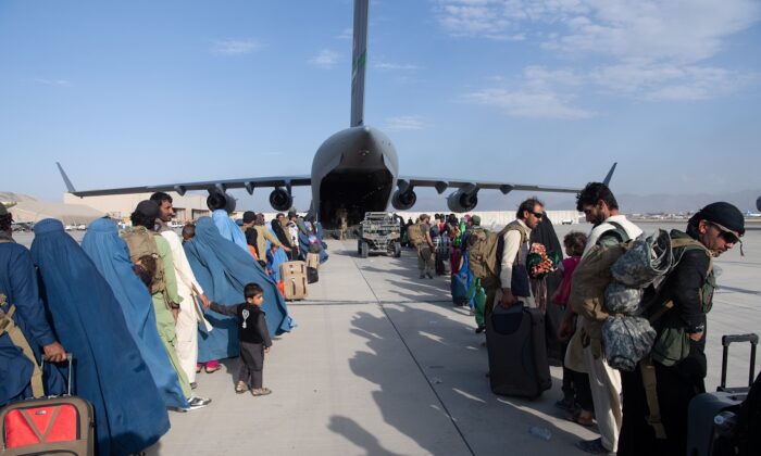 Passengers committee  a U.S. Air Force C-17 astatine  Hamid Karzai International Airport successful  Kabul, Afghanistan, connected  Aug. 24, 2021. (Master Sgt. Donald R. Allen/U.S. Air Forces Europe-Africa via Getty Images)