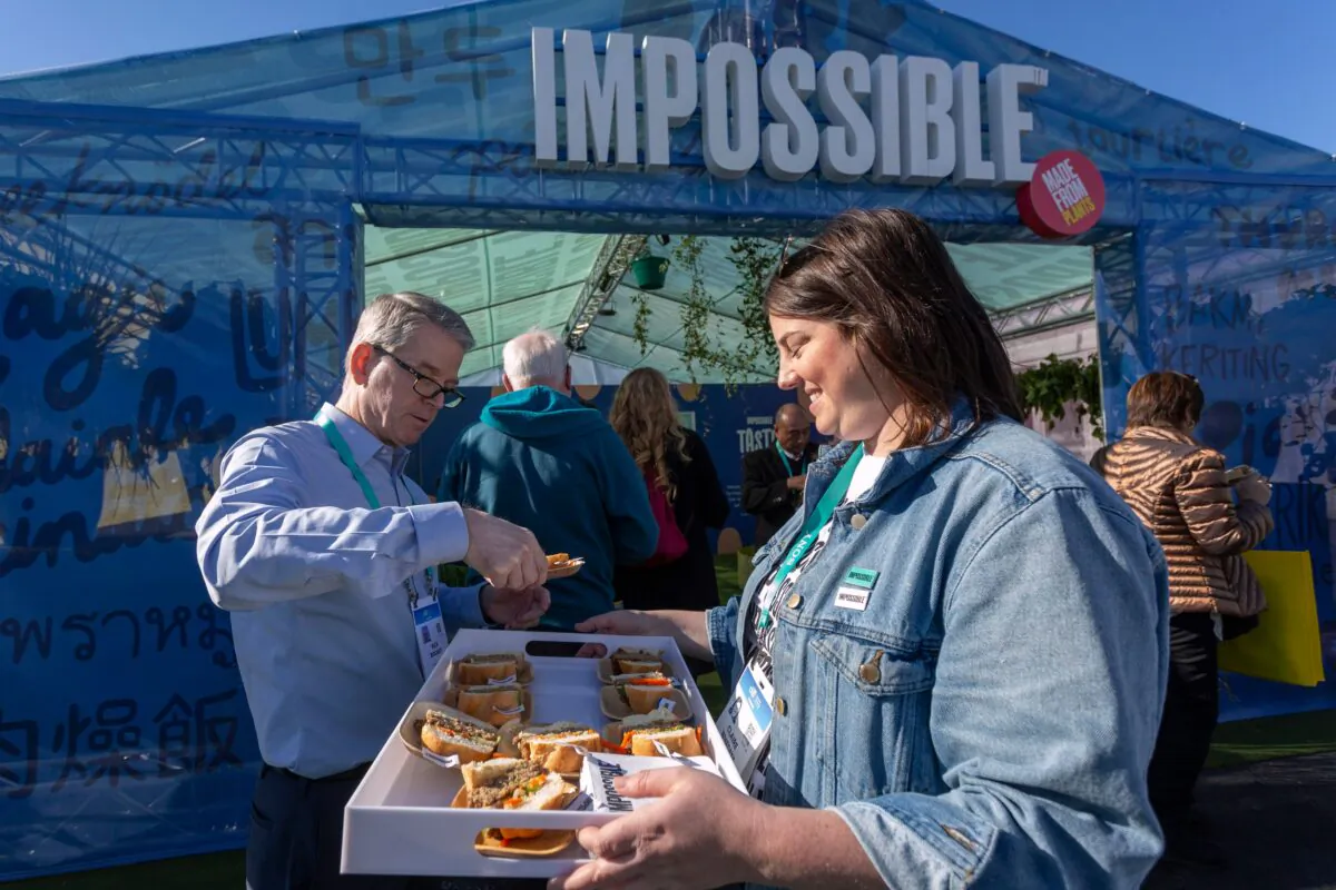 A woman serves a plant-based pork product by Impossible Foods, at the 2020 Consumer Electronics Show (CES) in Las Vegas, Nevada, on Jan. 9, 2020. (David McNew/AFP/Getty Images)
