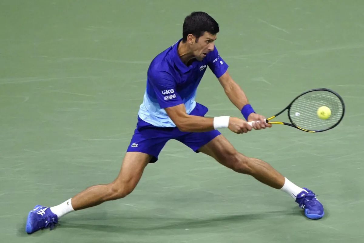 Novak Djokovic of Serbia returns against Jenson Brooksby of the United States during the fourth round of the U.S. Open tennis championships in New York on Sept. 6, 2021. (John Minchillo/AP Photo)